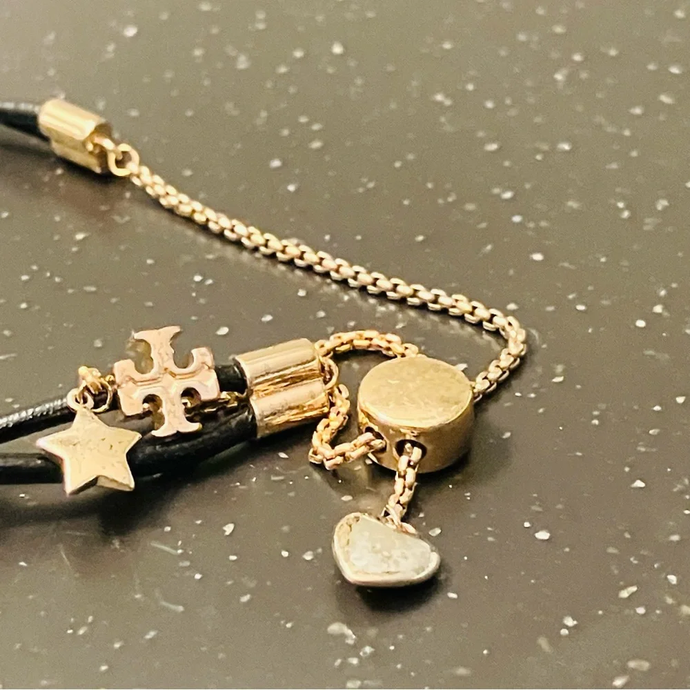 Tory Burch-Kira Double Leather Slider Bracelet in Black and Gold. Shows min wear